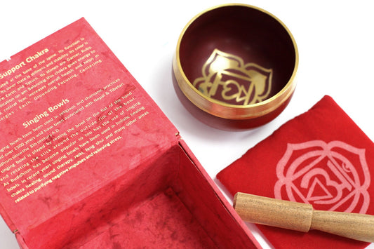 Vibrant red box, cloth, and gold root chakra singing bowl