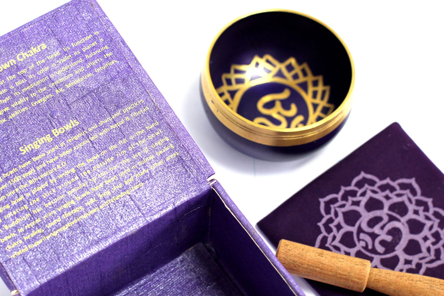 A purple box with intricate gold and purple design meditation crown chakra singing bowl