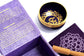 A purple box with intricate gold and purple design meditation crown chakra singing bowl